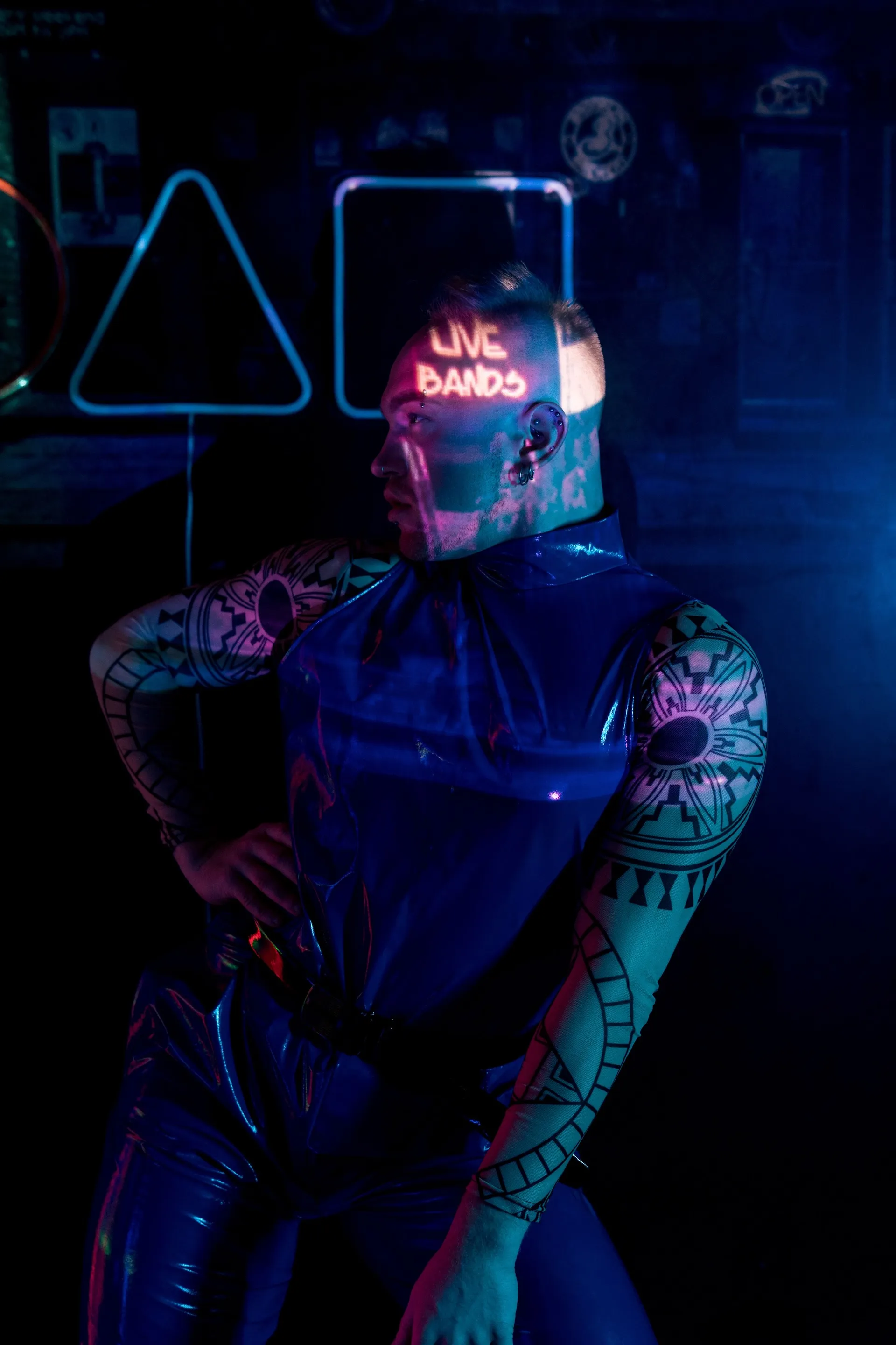 Club-goer in neon blue light at Cruise Club Cairns, a gay club in Cairns